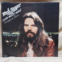 Front cover of Bob Seger 'Stranger in Town' album with artist portrait and title text.