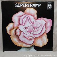 Front cover of Supertramp vinyl LP album, showing the stylized rose with human face illustration, album title, and A&M Records logo.