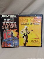 Front covers of the two VHS tapes: 'Rust Never Sleeps' and 'Heart of Gold' by Neil Young