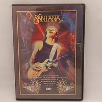 Front cover of Santana Live DVD showing Carlos Santana playing guitar with colorful artwork.