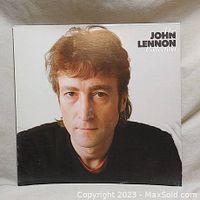 Front cover of 'The John Lennon Collection' vinyl album showing a close-up portrait of John Lennon.