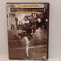 Front cover of Tina Turner Live in Amsterdam DVD showing the artist and title.