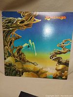 Front cover of the Yes album "Yesterdays" showing psychedelic surreal artwork with figures and abstract natural elements.