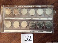 Full set of 12 Canadian 25 cent coins commemorating 125 years of Confederation in a plastic sleeve labeled by month and province/territory.