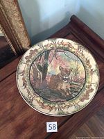 Top-down photo showing full platter with lioness in center and surrounding African wildlife scene.