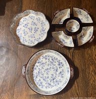 Overview of all items in the lot including two serving dishes and five-piece set.