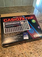 Photo of original Casio FX-730P box showing branding, product image and key features.