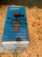 Original blue packaging for Form swim goggles with warning text and recycling symbol, showing only part of the box.