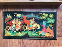 Front view of the painted panel showing the detailed knight and robed figure artwork with castle and nature elements.