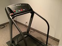 Side and front view of the TRUE Soft System treadmill showing the entire structure including handrails and belt