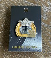 Full view of the Hard Rock limited edition 50th core pin mounted on original black card with gold 'Limited Edition' text.