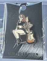 Full view of the Hard Rock Y2K Decade Girl pin in packaging on black backing card showing design and limited edition text.