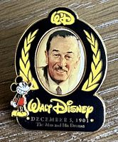 Photo of a Walt Disney collector pin featuring a portrait, text, and Mickey Mouse figure.