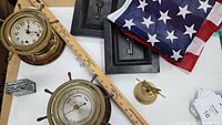 Overview showing clock, barometer, bell, flag, and framed keys.