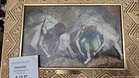 Framed painted artwork showing ballerinas in muted colors, impressionistic style.