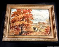 Frontal view of the framed painting showing autumn landscape