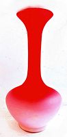 Full view of antique peachblow satin glass vase with a long neck, flared rim, and rounded body, showing the color gradient from pink to reddish-pink.