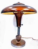 Front view of the Art Deco mushroom table lamp showing the wide mushroom cap shade and column base.