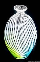 Front view of the Murano glass vase showing the swirl pattern from white lines with blue and green color gradient at the base.