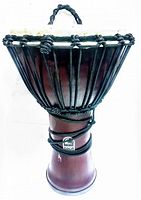 Front view of a wooden djembe drum with black tuning ropes and a Toca logo visible on the side of the body.