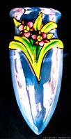 Front view of the vintage hand painted wall mount pocket vase showing floral design.