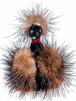 Front view of vintage mink poodle brooch showing detailed fur texture, poodle head with green eyes, and red collar.
