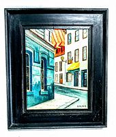 Frontal photo of the framed oil painting showing the painted street scene and artist signature.