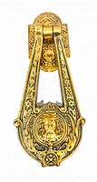 Photo of the full brass door knocker showing its overall design and dimensions