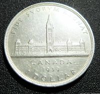 Reverse side showing Canadian Parliament Buildings with inscriptions and date.
