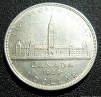 Reverse side of the 1939 Canadian silver dollar showing Peace Tower and inscriptions.