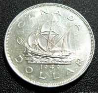 Reverse side showing the Bluenose schooner, inscriptions CANADA, 1949, and DOLLAR.
