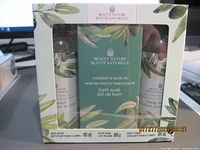 Photo of the boxed Beauty Nature set containing body wash, bath soak, and body scrub with coconut and olive oil.