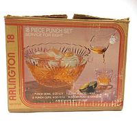 Box front showing vintage Arlington 18 piece punch set with punch bowl, ladle, cups, and hangers illustrated with product details and quantity specifications.