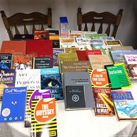 Full view of the book collection on a table showing multiple titles and colorful covers