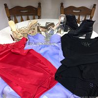 Photo showing all shoes and dresses laid out on table