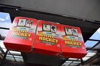 Three unopened red and white boxes labeled Score 1991 NHL Series 1 hockey cards English Edition, displayed closed.