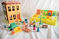 Fold-out Sesame Street Play Family town with various vintage plastic furniture, accessories, and Poppin Pals figures