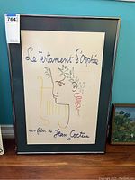 Overall frontal view of framed poster with lot sticker