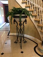 Full-height front view of planter urn with stand, showing overall proportions