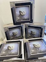 Five new boxed light-up wall display case cubes stacked with visible product photo on boxes.