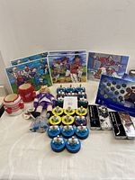 Photo showing the assorted NHL sports collectibles including greeting cards, figures, stick sets, and cup holders laid out together.