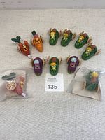 Set of 11 Fraggle Rock wheeled toys arranged on a surface; includes two toys in original bags and nine unpackaged toys representing Boober, Wembley, and Red Fraggle characters.