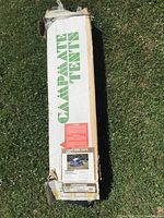 Box labeled 'Campmate Tents' with label showing 'Laurentian Model' tent details and condition noted as used.