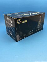 Front and side of the black Ovlife Merry Christmas fairy lights box showing branding.