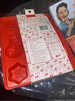Photo of red Jell-O holiday mold with 5 shaped cavities and packaging