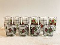 Set of 10 vintage glasses with red rose pattern and white grid background, 6 tall and 4 short glasses shown from front.