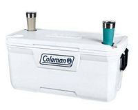 White Coleman 316 Series hard cooler with two insulated cups placed in lid cup holders, showing side handles and logo on front.