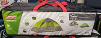 Original packaging bag with printed product details, Coleman branding, features, and tent image.