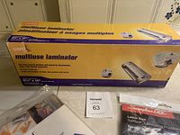 Staples multiuse laminator box and laminator with HeatSeal 25-pack heat-sealed laminate sheets and Swingline GBC self-seal laminating pouches