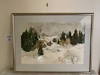 Framed winter countryside watercolour showing snow, trees, and landscape. Slight damage to paper backing visible.